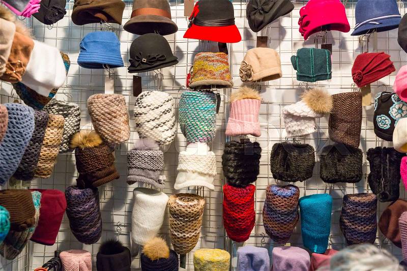 Showcase in women hat shop, fabric textile, colorful headwears, stock photo