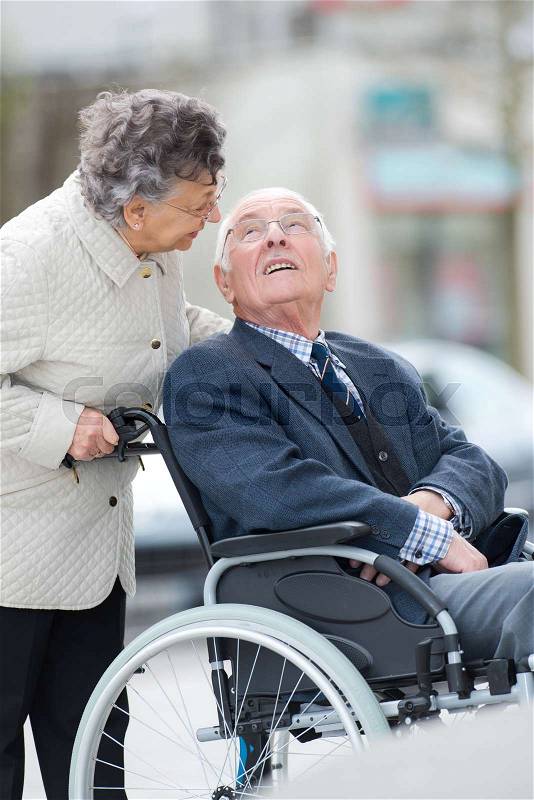 Senior couple in wheelchair, stock photo