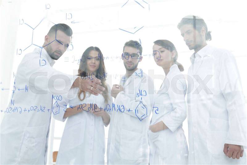 In the background image group laboratory scientists discussing their research.concept of a scientific experiment, stock photo