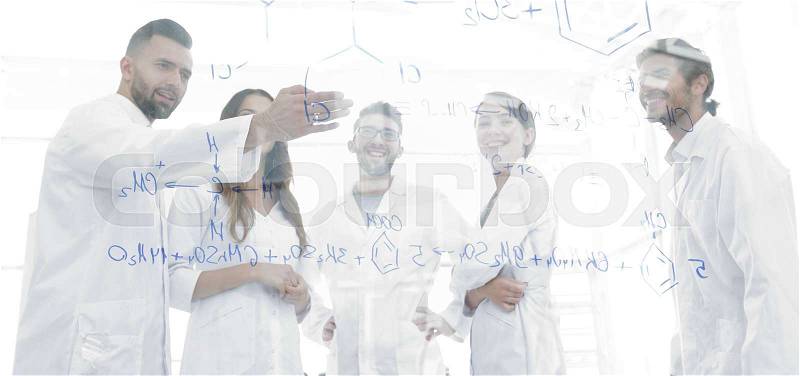 Group of laboratory scientists discussing their research in the laboratory.the concept of a scientific experiment, stock photo