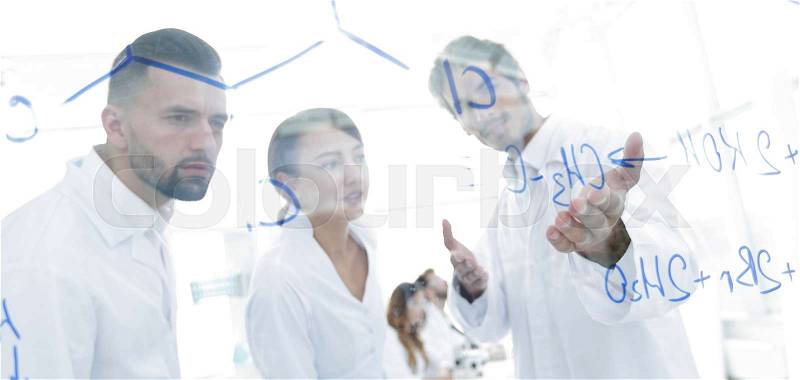 Group of laboratory scientists discussing their research in the laboratory.the concept of a scientific experiment, stock photo