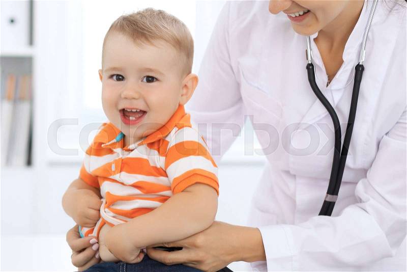 Little boy child at health exam at doctor\'s office, stock photo