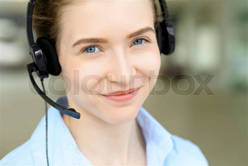 Portrait of beautifull business woman in headset. Call center operator, stock photo