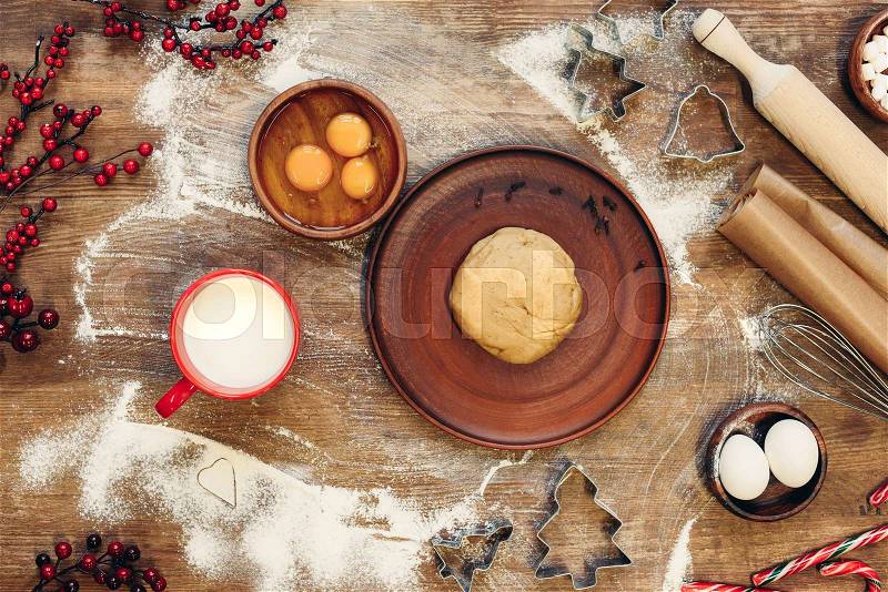 Top view of ingredients and gingerbread dough for christmas cookies, stock photo