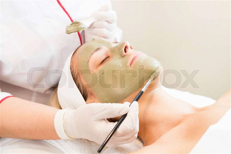 Process cosmetic mask of massage and facials in beauty salon, stock photo