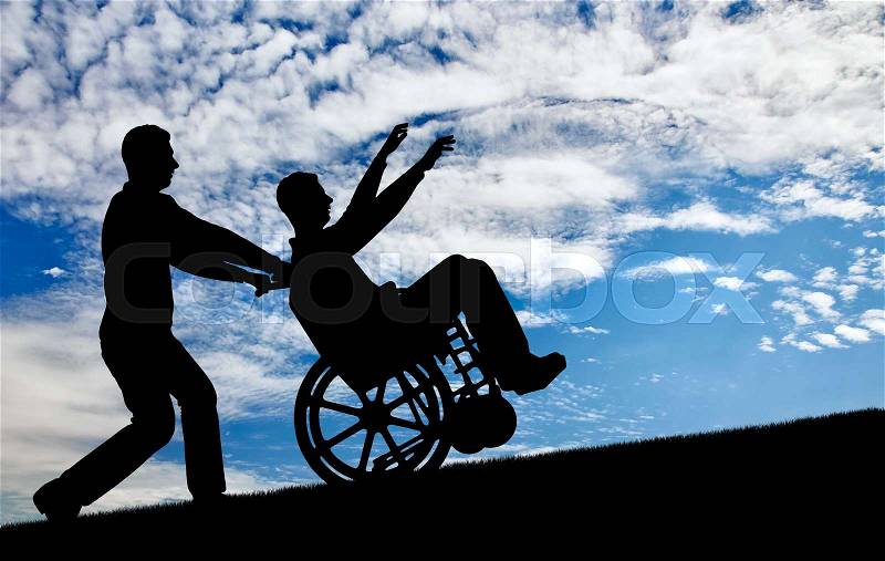 Happy disabled person in a wheelchair having a great time with the family. The concept of care and disability, stock photo