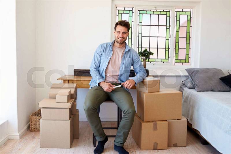 Portrait Of Man In Bedroom Running Business From Home, stock photo