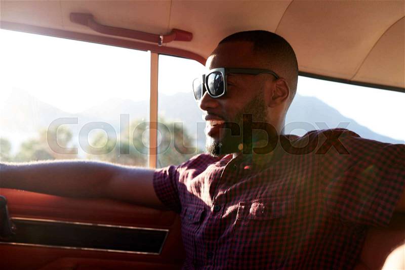 Man Relaxing In Car During Road Trip, stock photo