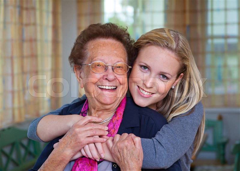 A grandson to visit his grandmother fun and pleasure in the embrace, stock photo