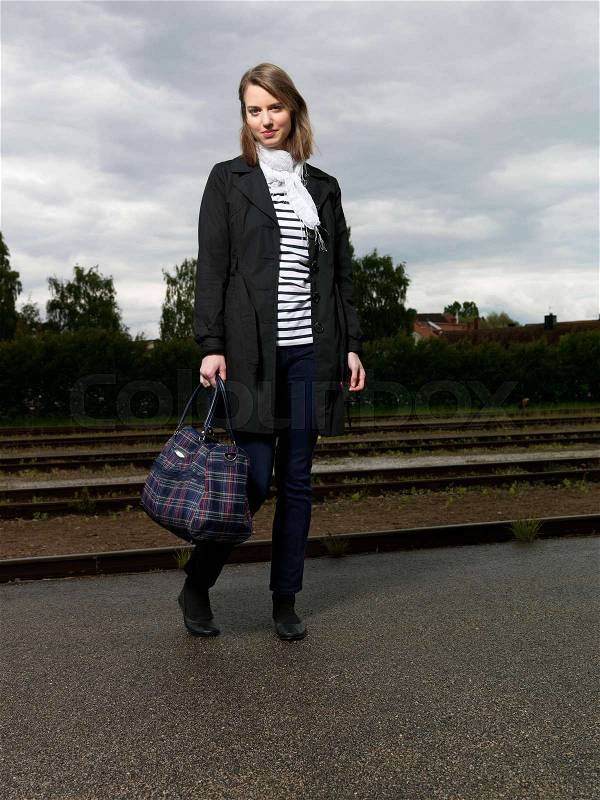 Woman on train station, stock photo
