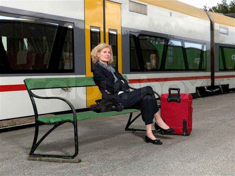 Mature woman on train station, stock photo
