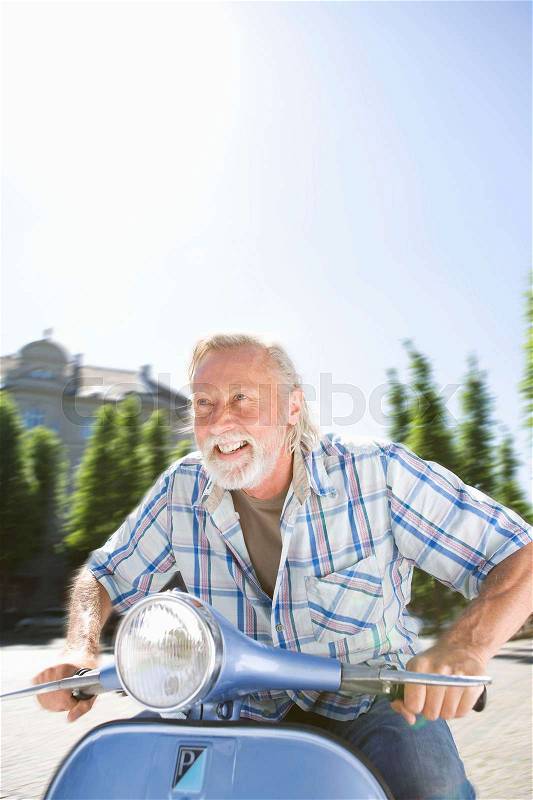 Man on scooter, stock photo