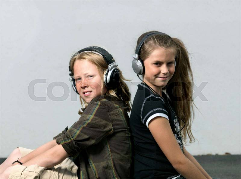 Two kids with head phones, stock photo