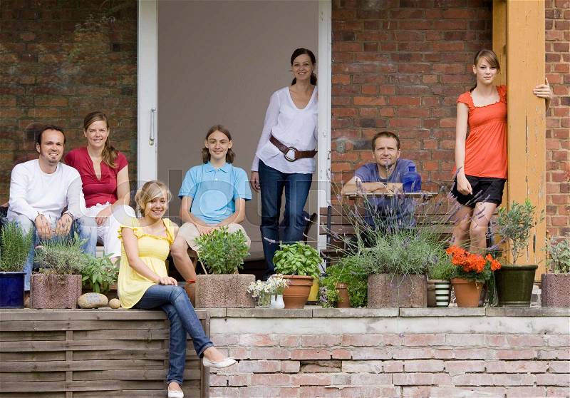 Group portrait of a family on the porch, stock photo