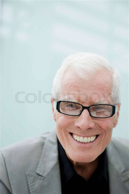 Older man smiling at viewer, stock photo