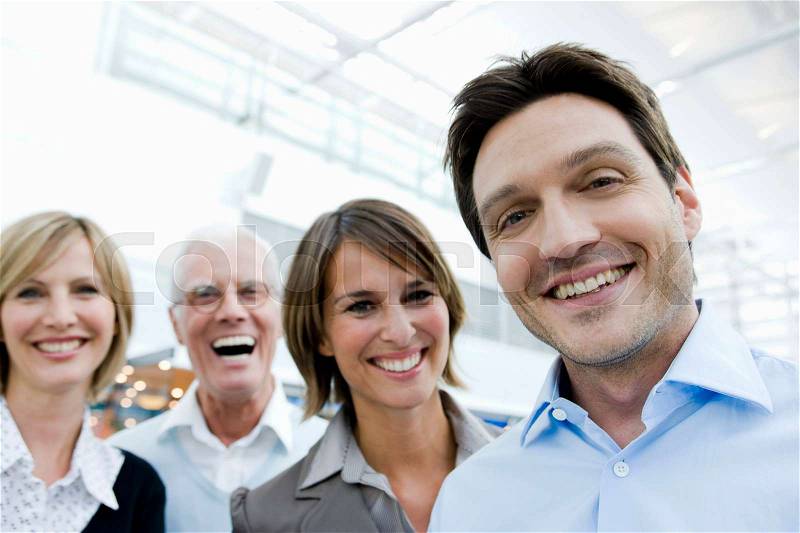 4 happy people looking at viewer, stock photo