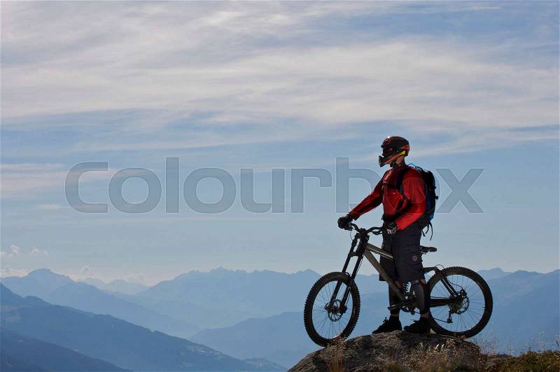 Mountain biker taking in the view, stock photo