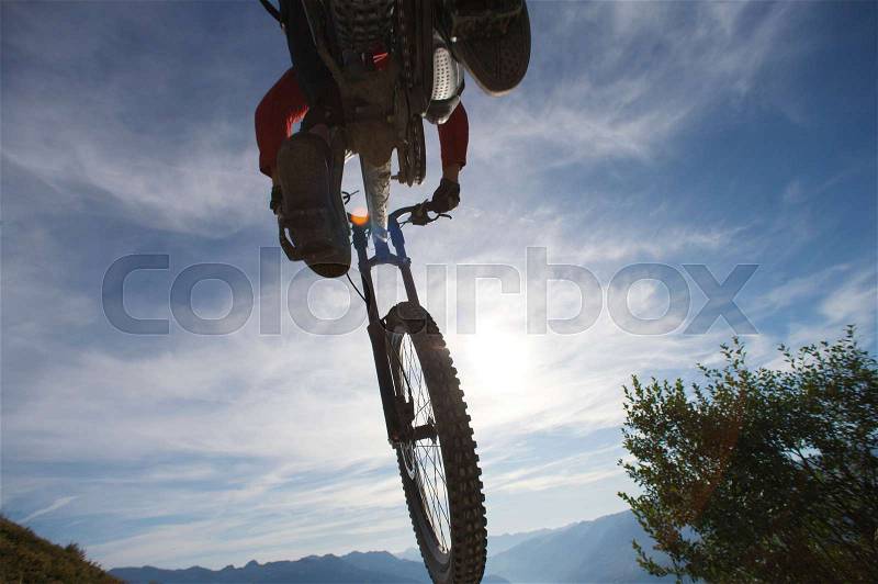 Mountain biker jumping, stock photo