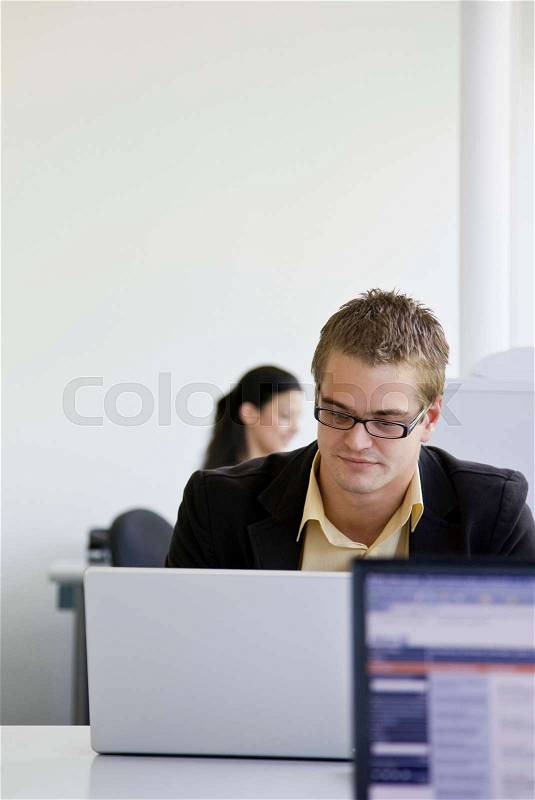 Workers in busy office, stock photo