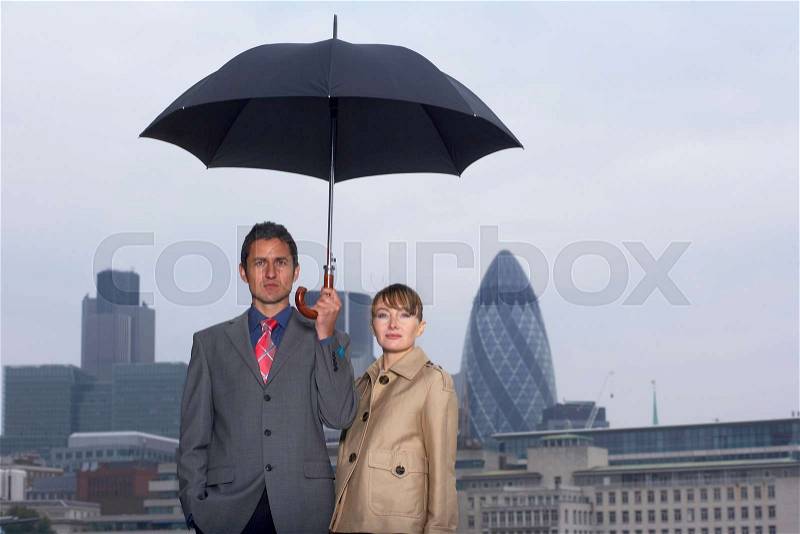 Man & Woman with Umbrella City Scape, stock photo