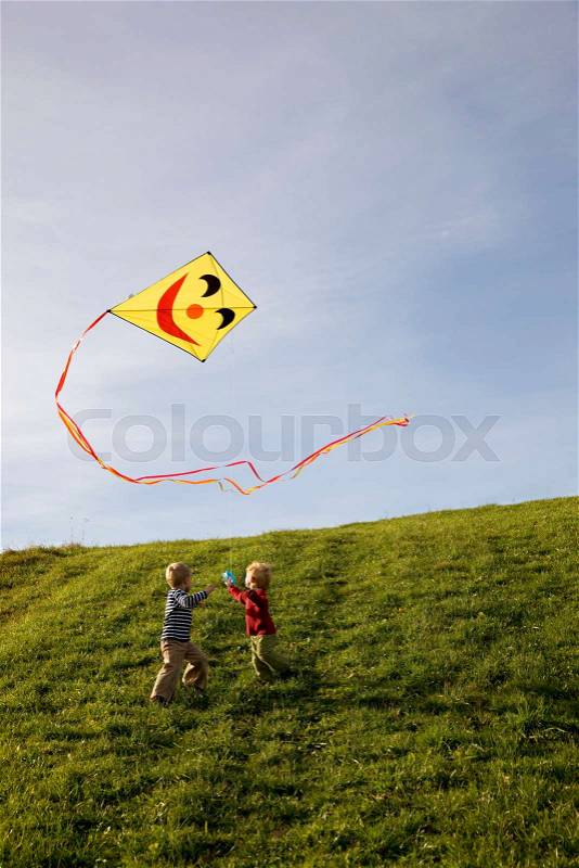 Two Boys fly a Kite, stock photo