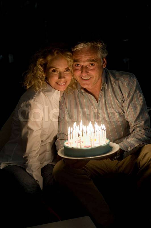 Man and woman with cake, stock photo