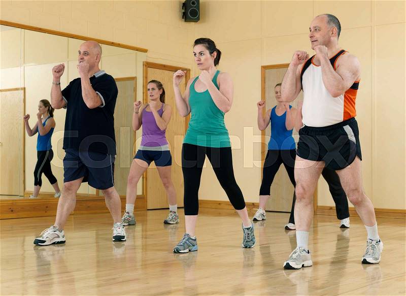 Aerobic exercise at gym, stock photo