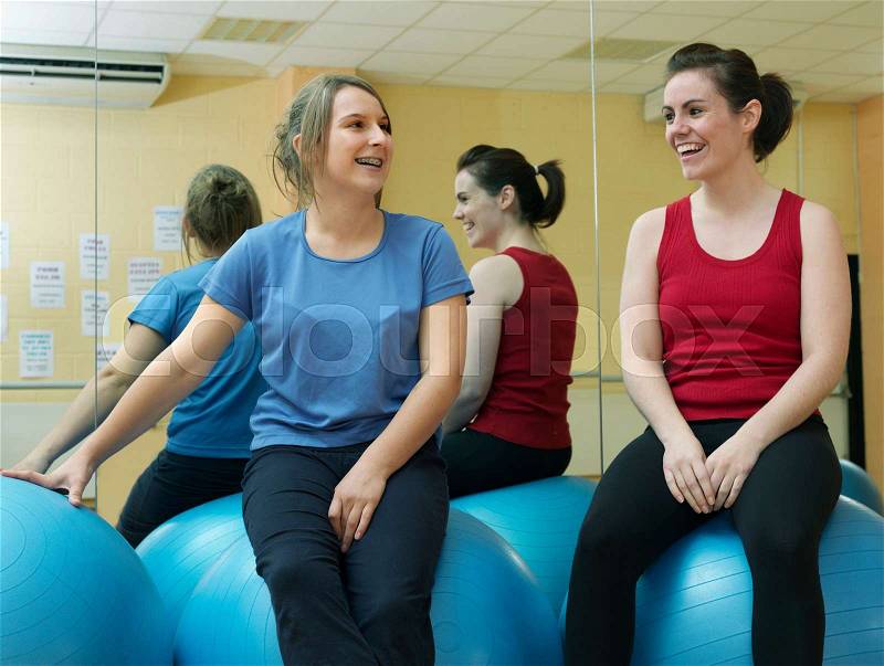 Women relaxing at gym, stock photo