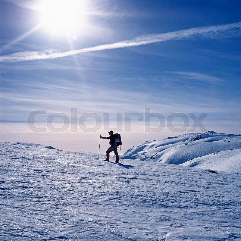 Man skiing on mountain, stock photo