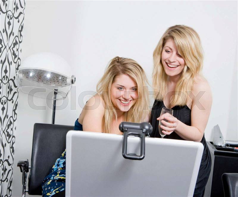 Women at hairdressers with web cam, stock photo