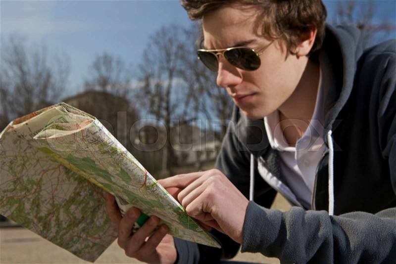 Man looking on the map, stock photo