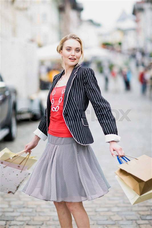 Woman in shopping street, stock photo