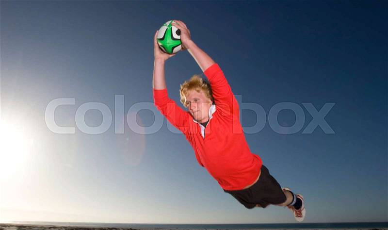 Rugby Player scoring a try, stock photo