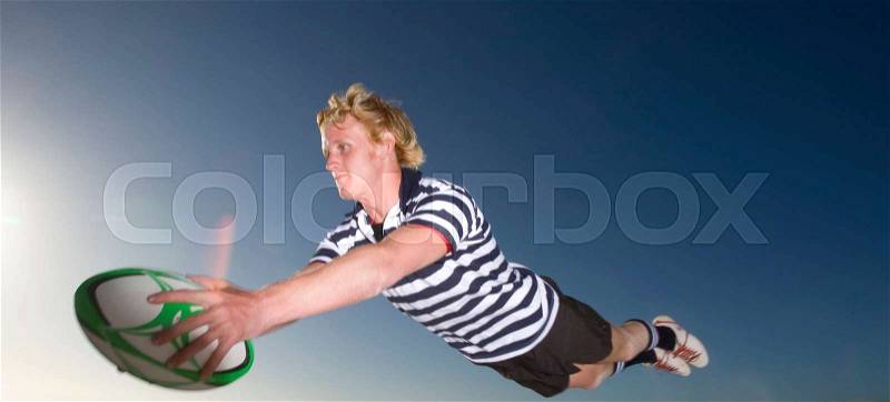 Rugby Player scoring a try, stock photo