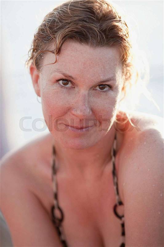 Woman in bikini smiling, stock photo