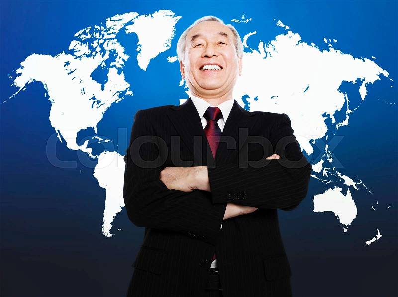 Asian man smiling in front of world map, stock photo