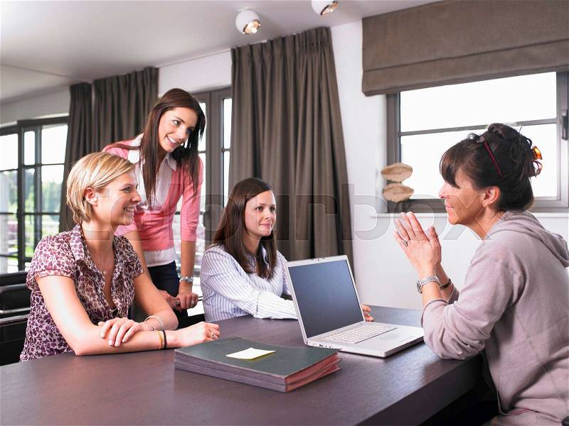 Women in a reunion at the office, stock photo