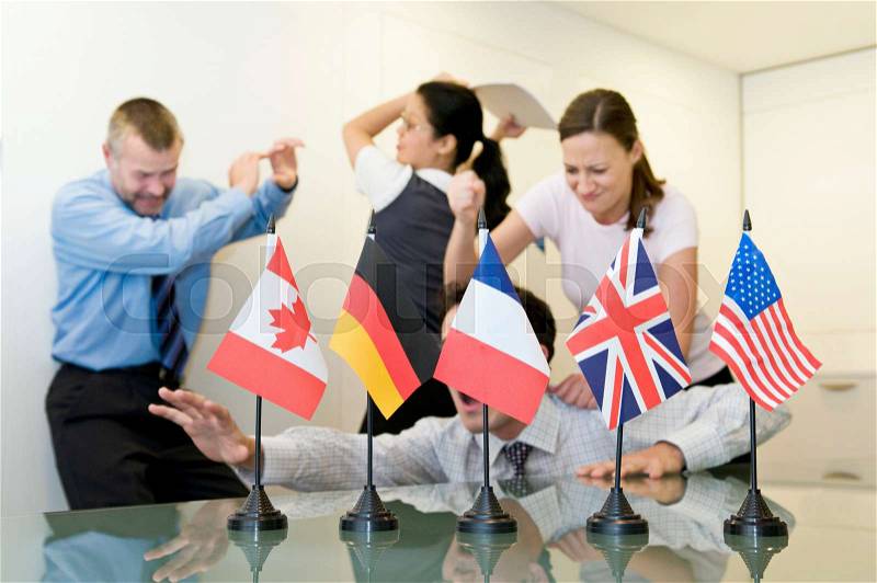 A business group fighting behind flags, stock photo