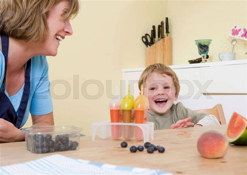 Boy and mum laughing, stock photo
