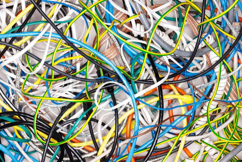 A tangle of colored wires on the ground, stock photo