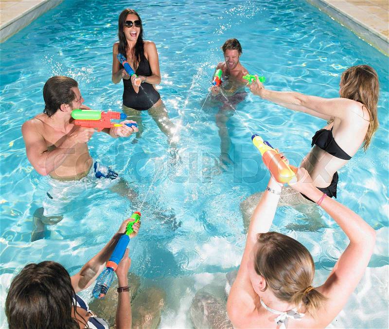 Water fight between young people, stock photo