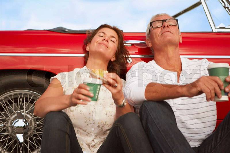 Couple with car, coffee break, stock photo