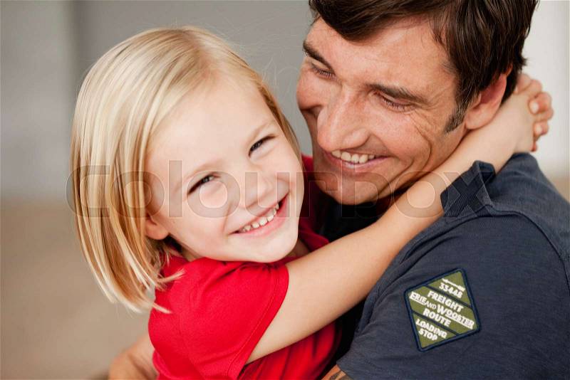 Father and daughter hugging, stock photo