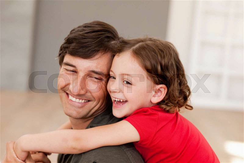 Father and daughter hugging, stock photo