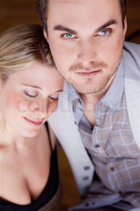 Woman resting head on mans shoulder, stock photo