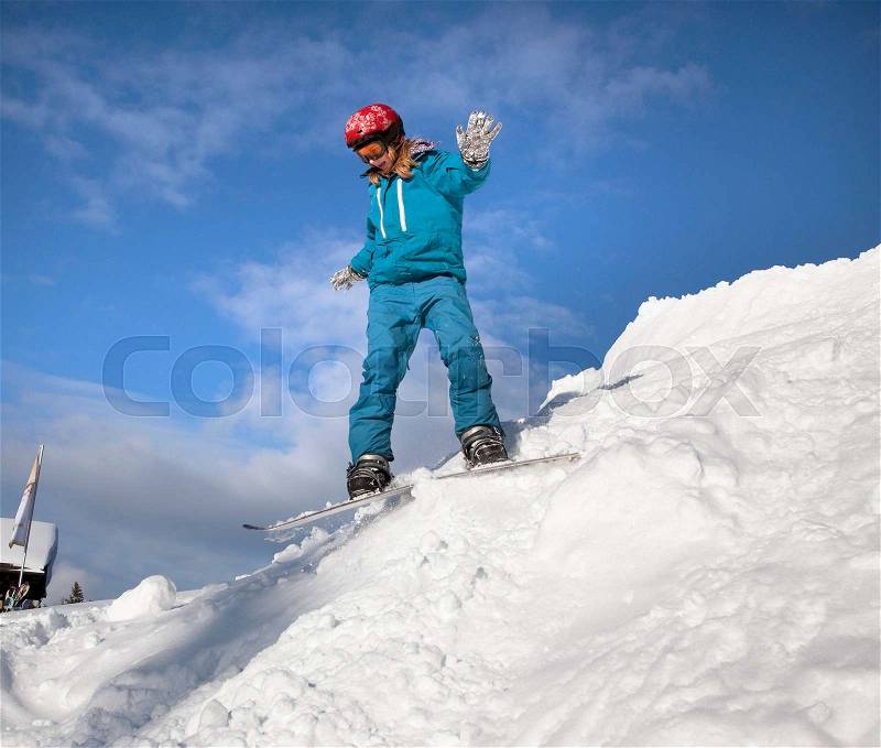 Girl snowboarding, stock photo