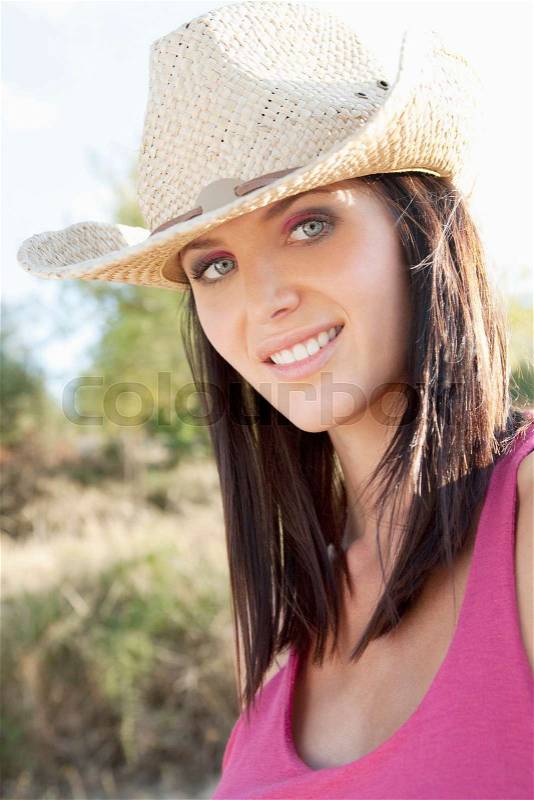 Portrait of a woman in a cowgirl hat, stock photo