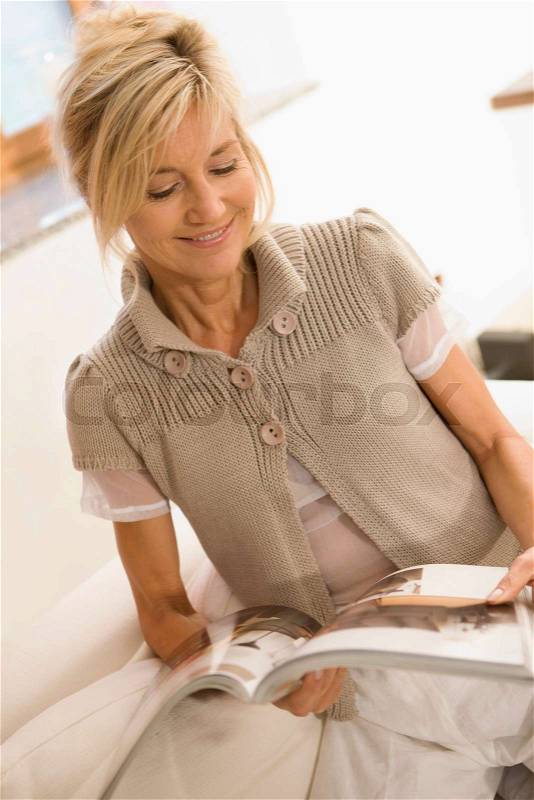 Woman reading a journal, stock photo