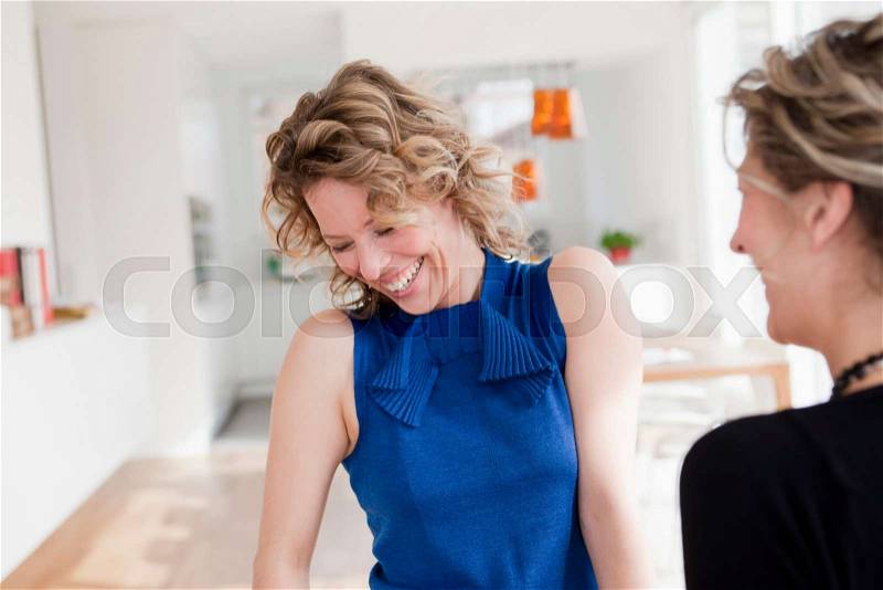 Two woman laughing, stock photo