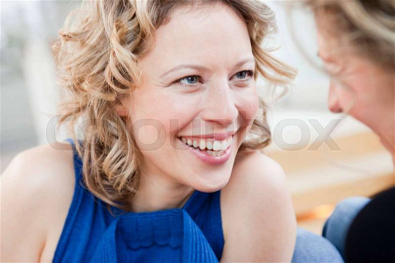 Two woman laughing, stock photo